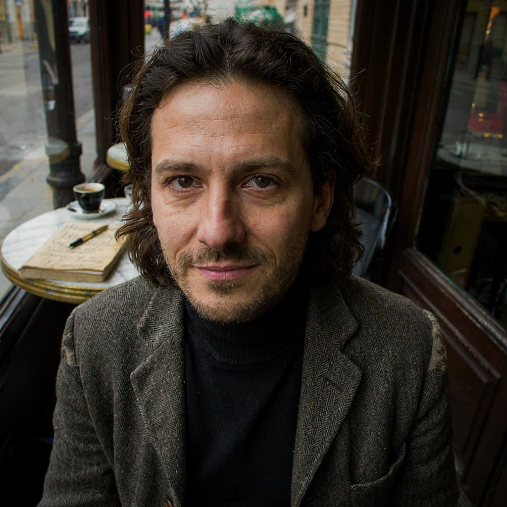 Cafe selfie of a male writer before headshot generation